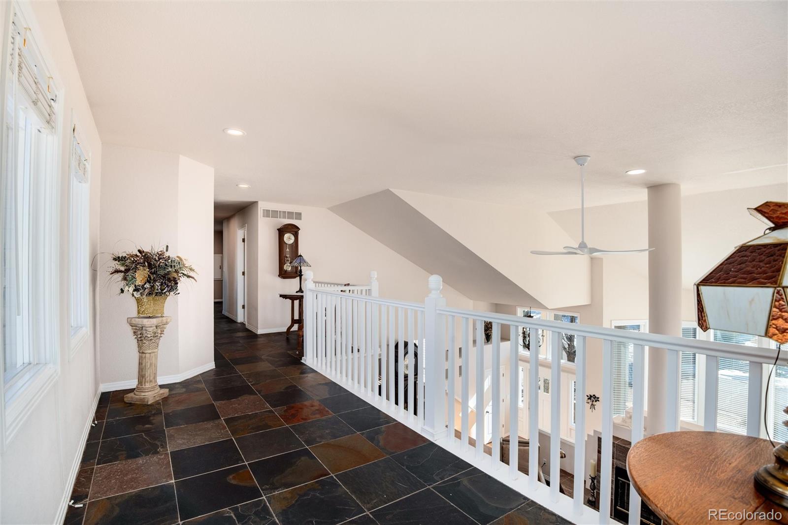 81 North Ranch Road Littleton, CO 80127 - Photo 15 of 38 a view of a hallway with windows