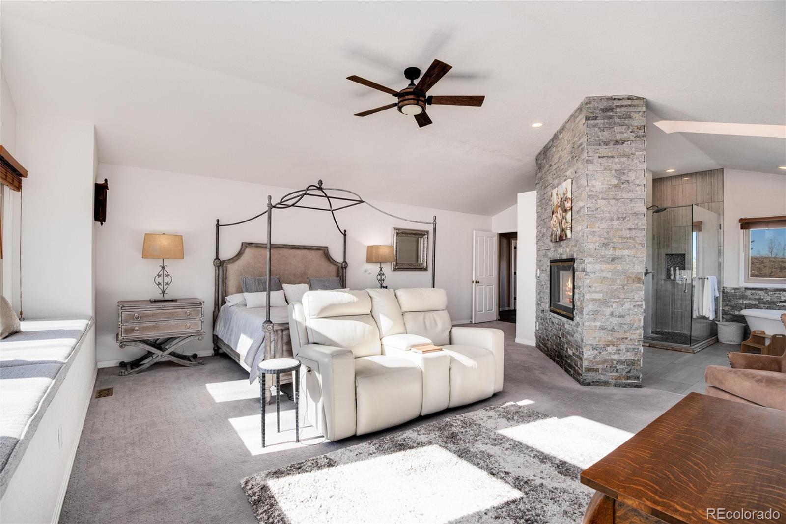 81 North Ranch Road Littleton, CO 80127 - Photo 18 of 38 a living room with furniture and a ceiling fan
