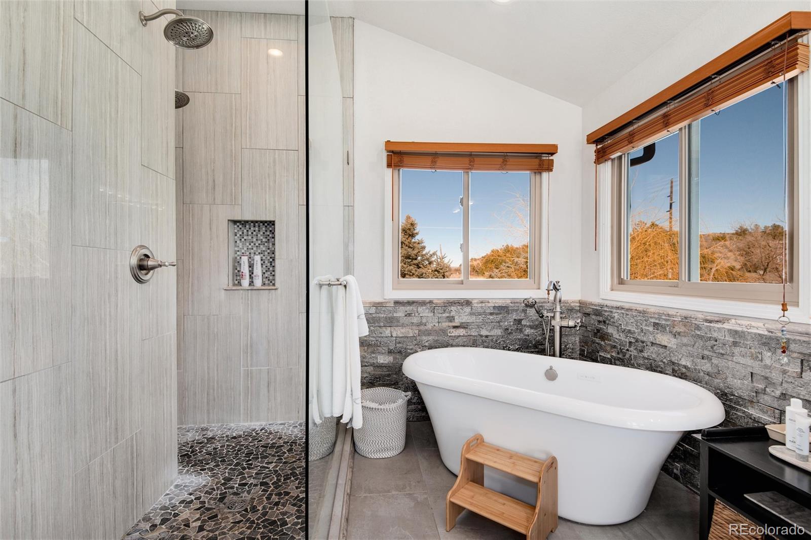 81 North Ranch Road Littleton, CO 80127 - Photo 21 of 38 a bathroom with a sink and a mirror