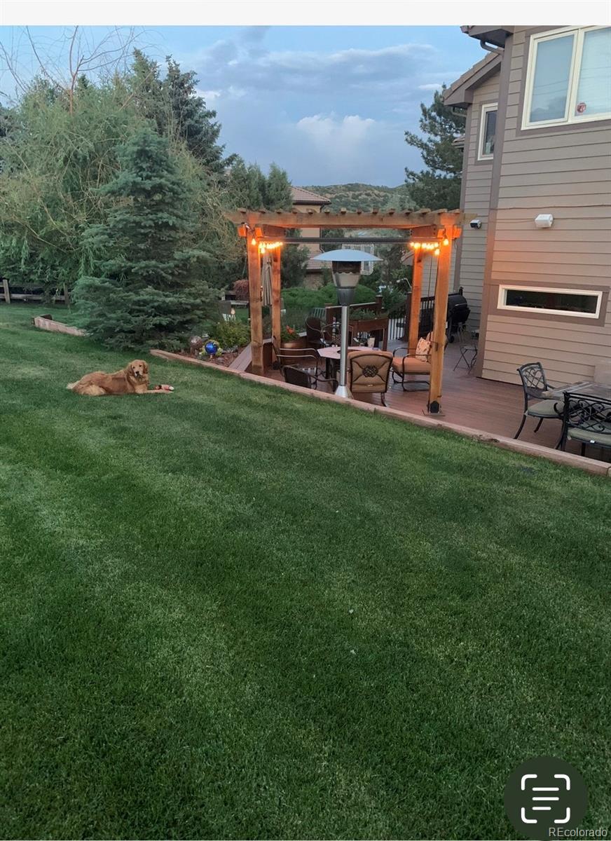 81 North Ranch Road Littleton, CO 80127 - Photo 29 of 38 a view of outdoor space with garden and seating area