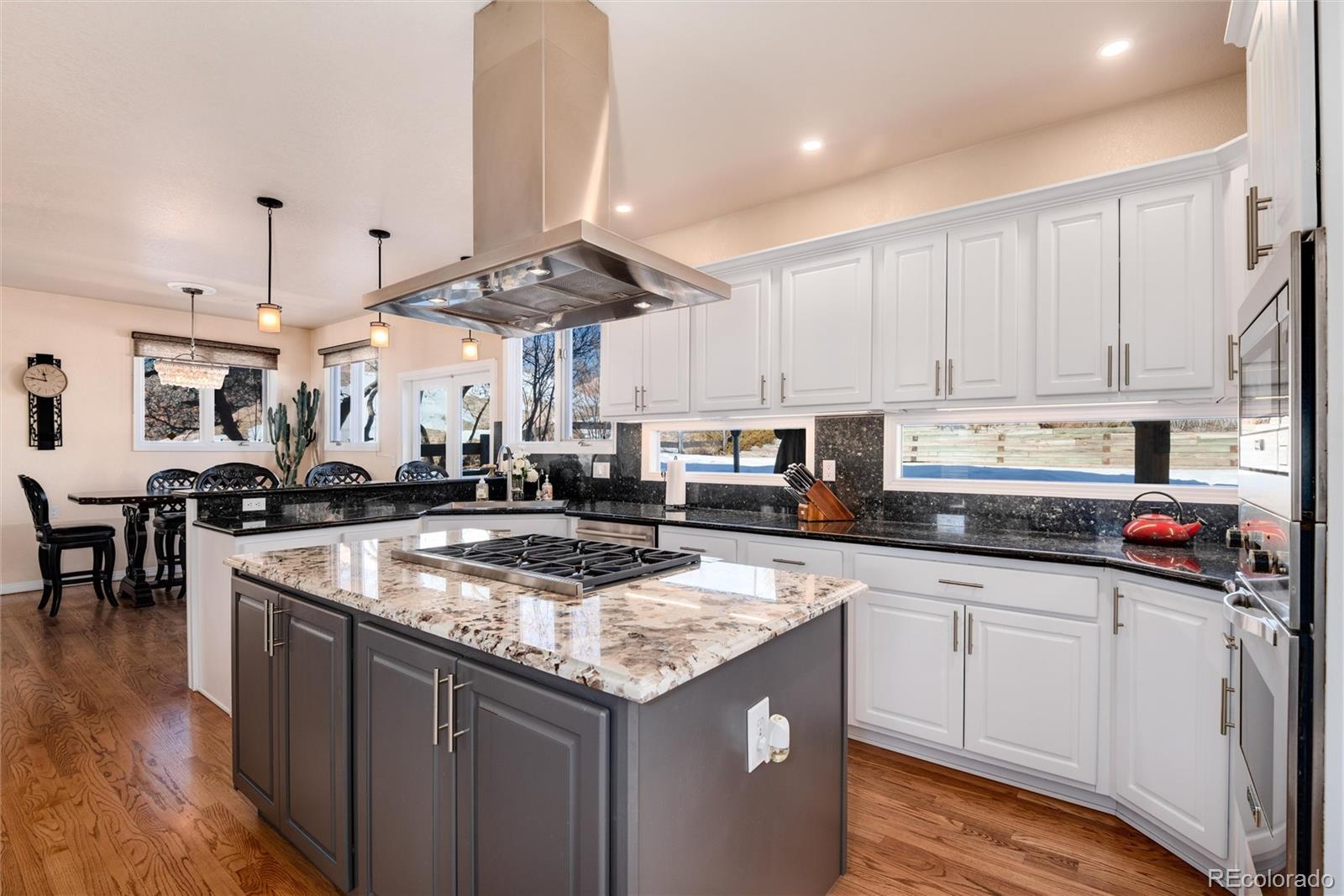 81 North Ranch Road Littleton, CO 80127 - Photo 3 of 38 a kitchen with stainless steel appliances granite countertop a sink a stove and a refrigerator