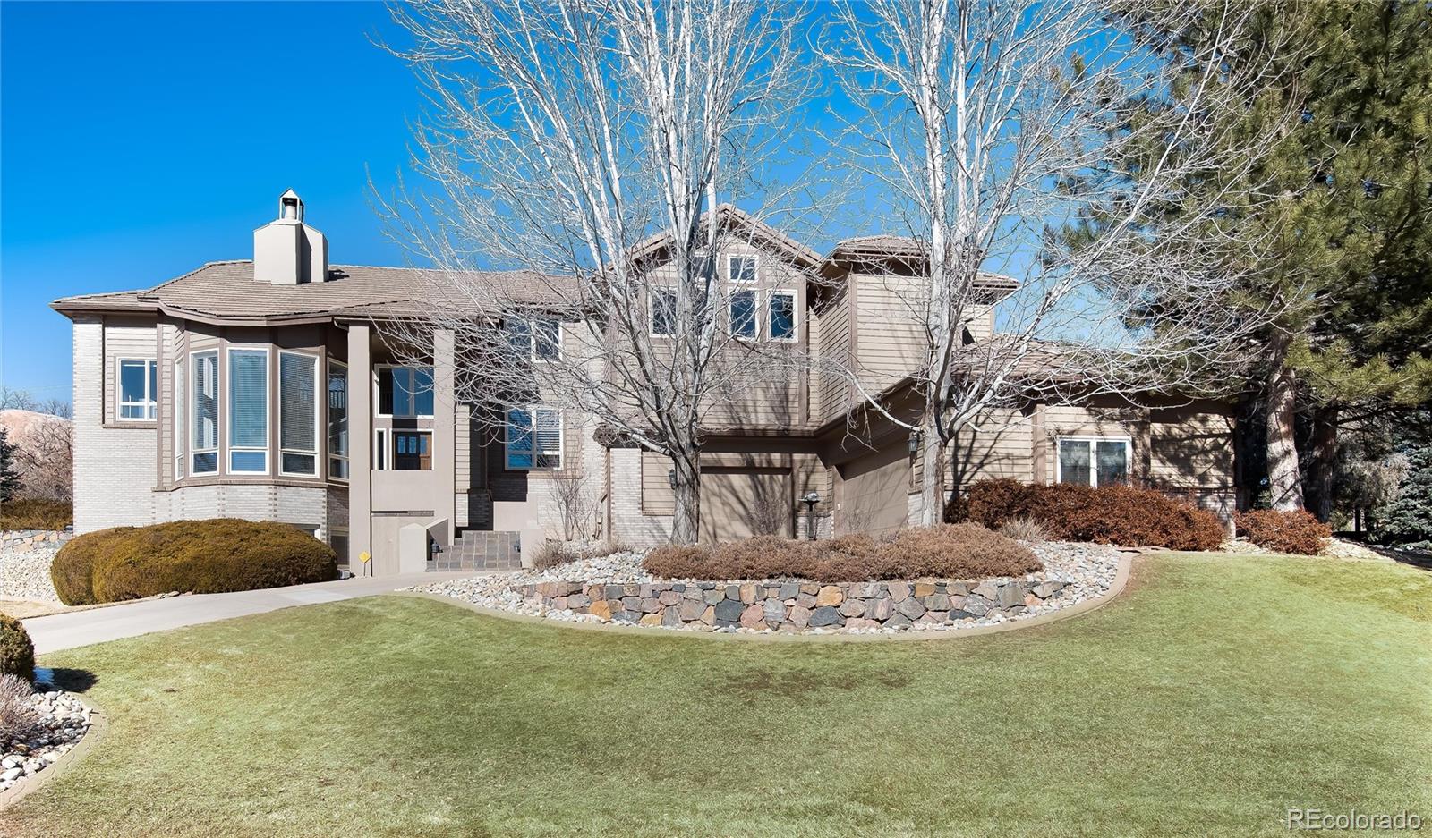 81 North Ranch Road Littleton, CO 80127 - Photo 32 of 38 a view of a house with a yard