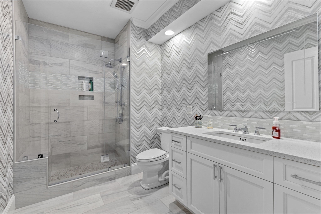 59 Walpole Street, Unit 116 Canton, MA 02021 - Photo 12 of 26 a bathroom with a sink toilet and shower