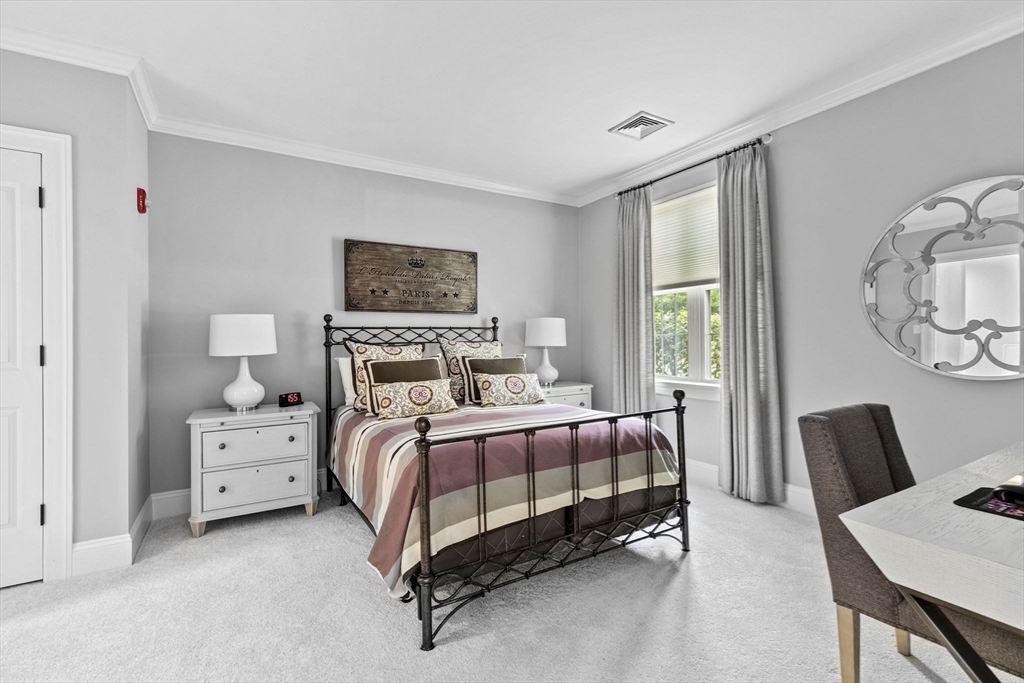 59 Walpole Street, Unit 116 Canton, MA 02021 - Photo 13 of 26 a bed room with a bed and a couch