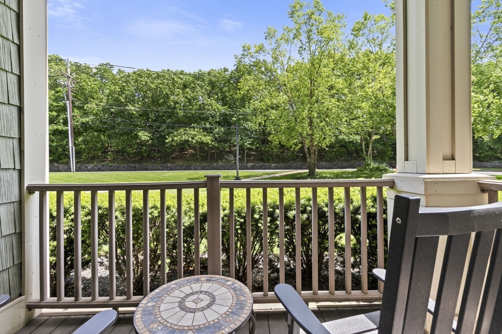 59 Walpole Street, Unit 116 Canton, MA 02021 - Photo 16 of 26 a view of a chair and table in the balcony