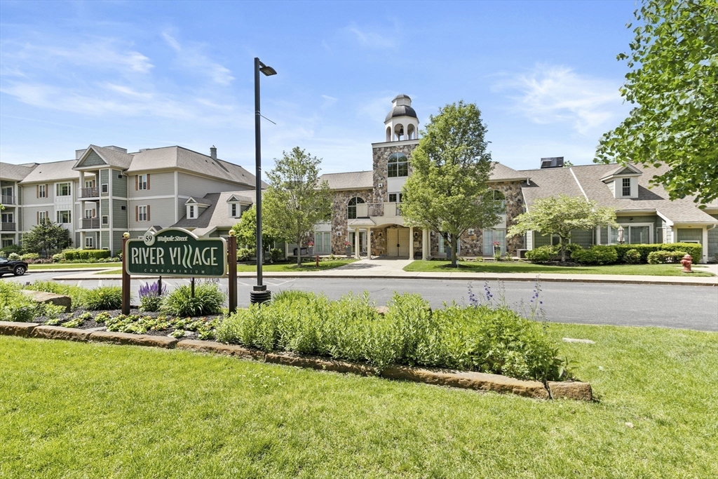 59 Walpole Street, Unit 116 Canton, MA 02021 - Photo 26 of 26 a house view with a garden space