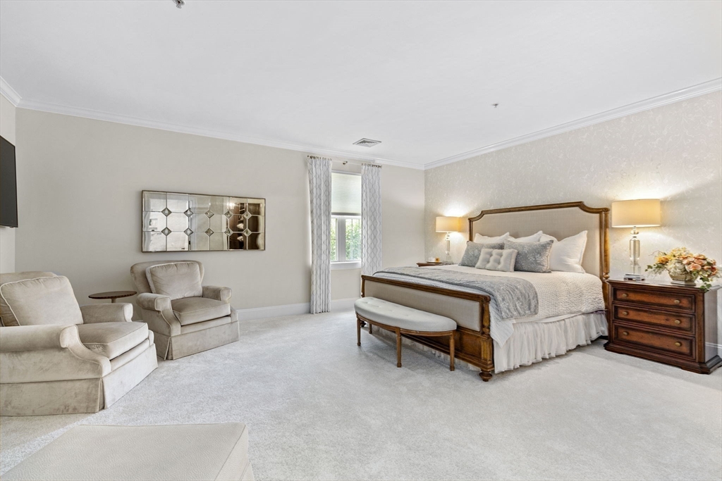 59 Walpole Street, Unit 116 Canton, MA 02021 - Photo 10 of 26 a bedroom with a bed and a couch