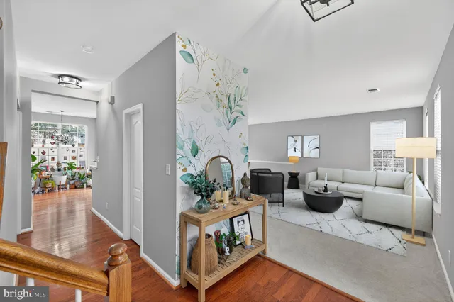 a living room with furniture a lamp and a window