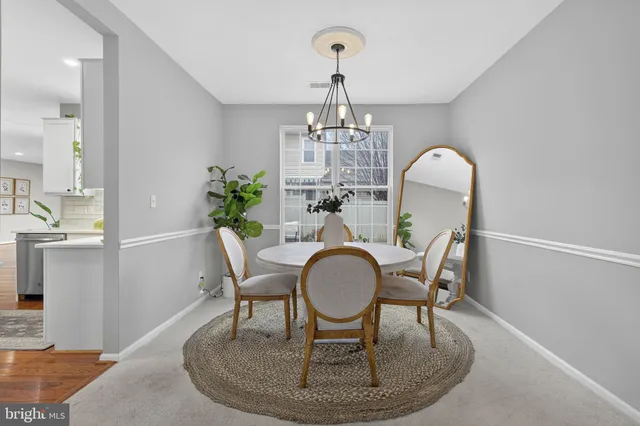 a bathroom with a toilet a sink and a mirror
