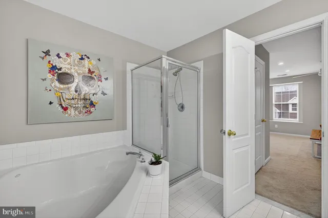 a bathroom with a granite countertop sink mirror and toilet