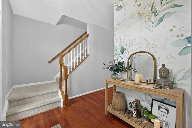 a view of entryway with wooden floor
