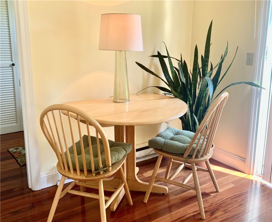 85 Quannacut Road, Unit A Westerly, RI 02891 - Photo 11 of 19 Adorable little kitchen eating nook beside the doors to the backyard. Open the blinds to let a ton of natural light pour in during your morning coffee.