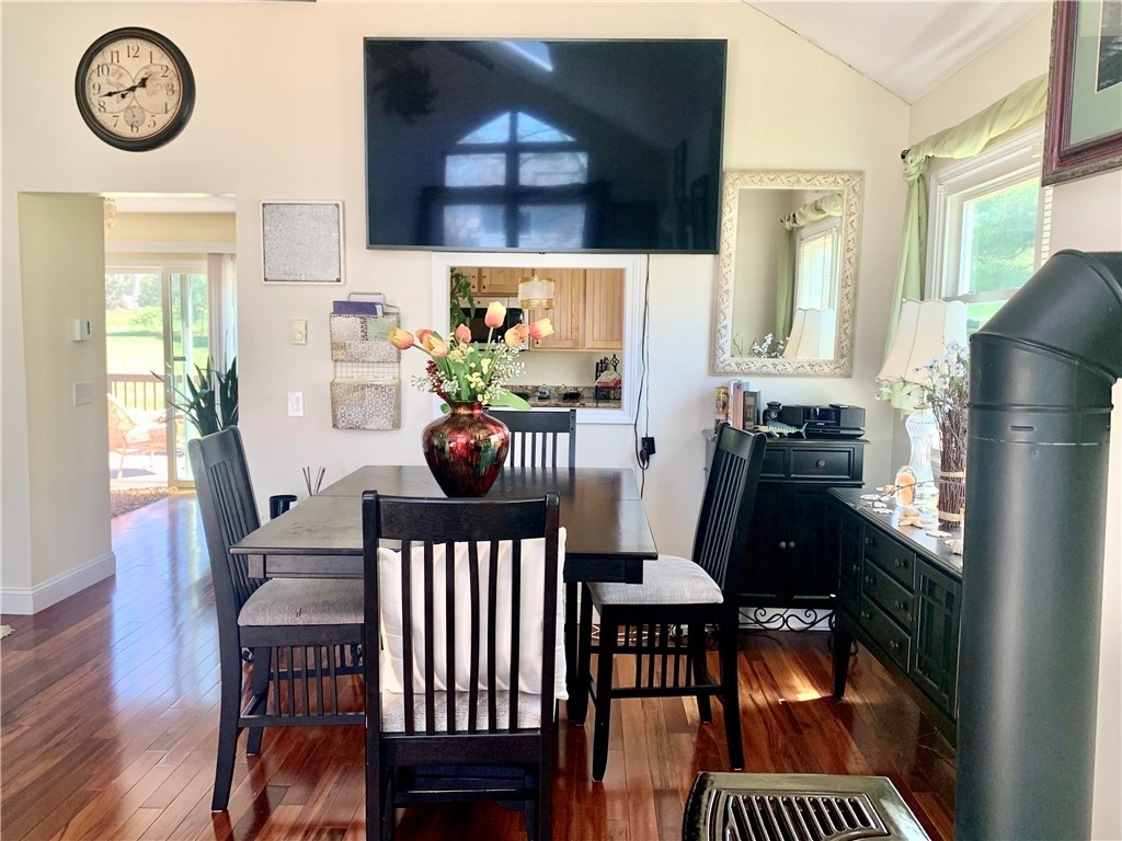 85 Quannacut Road, Unit A Westerly, RI 02891 - Photo 4 of 19 Beautiful sunny dining area looking toward the kitchen, back deck and grassy backyard.