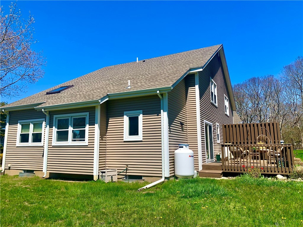 85 Quannacut Road, Unit A Westerly, RI 02891 - Photo 7 of 19 Sideview of condo and back deck.