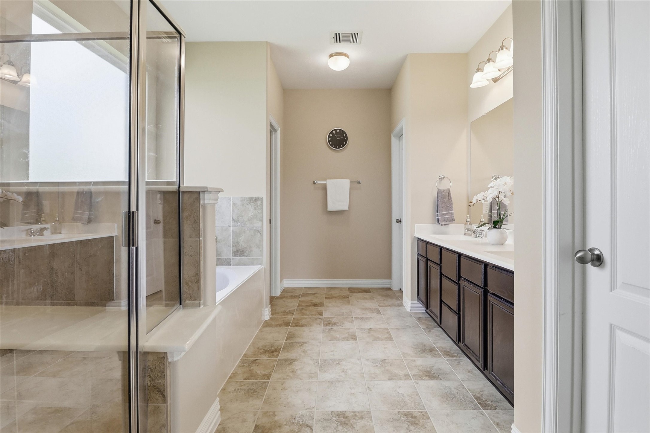 3219 Cotton Ranch Drive Katy, TX 77494 - Photo 19 of 45 Designed as a true extension of the primary suite, this spacious ensuite combines generous proportions with timeless finishes to create a relaxing, spa-inspired retreat.
