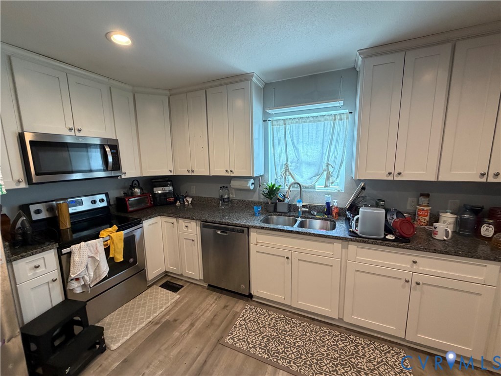 1124 Myrtle Street Suffolk, VA 23434 - Photo 5 of 15 Kitchen featuring ample white shaker cabinetry, gr