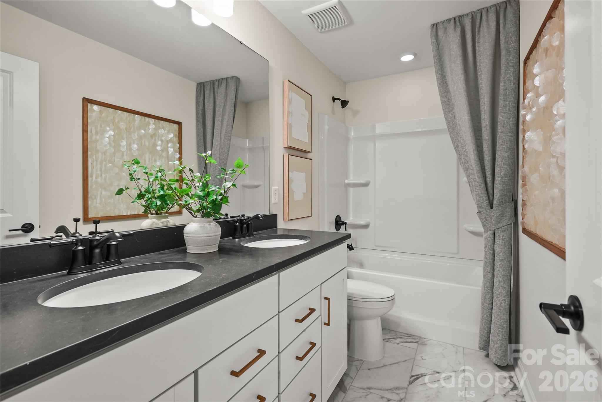 2149 Riverbend Avenue Monroe, NC 28110 - Photo 21 of 22 a bathroom with a granite countertop sink toilet and shower