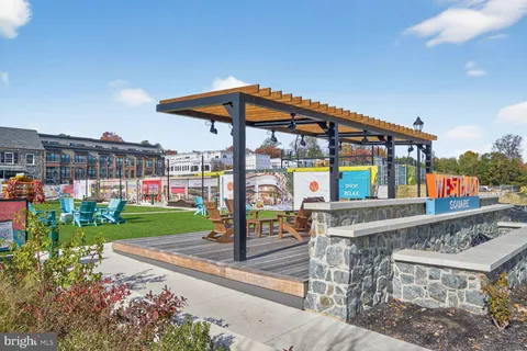a view of path along with retail shop and buildings