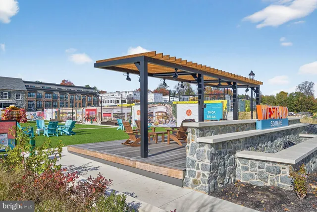 a view of path along with retail shop and buildings