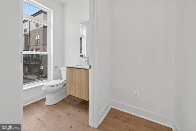 a view of kitchen with wooden floor and window