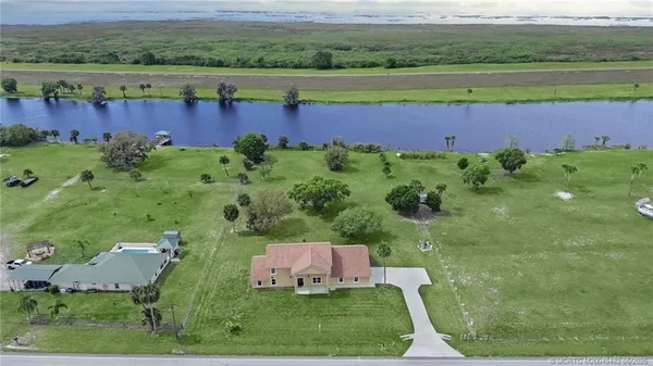 a view of yard with swimming pool and green space