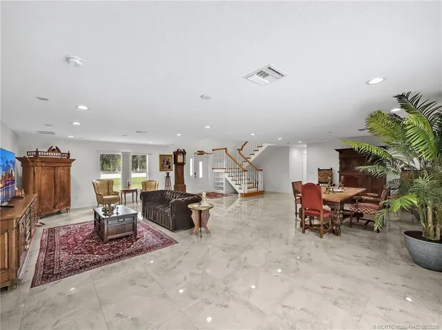 a living room with furniture and a table