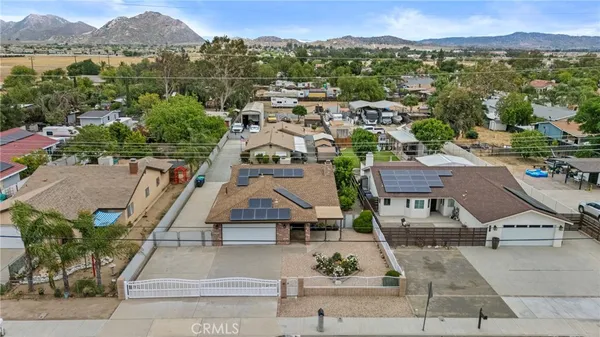 an aerial view of a city with streets and houses
