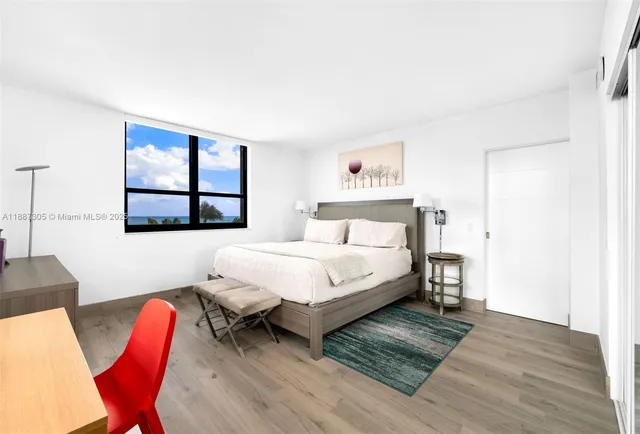 a bedroom with a bed and window