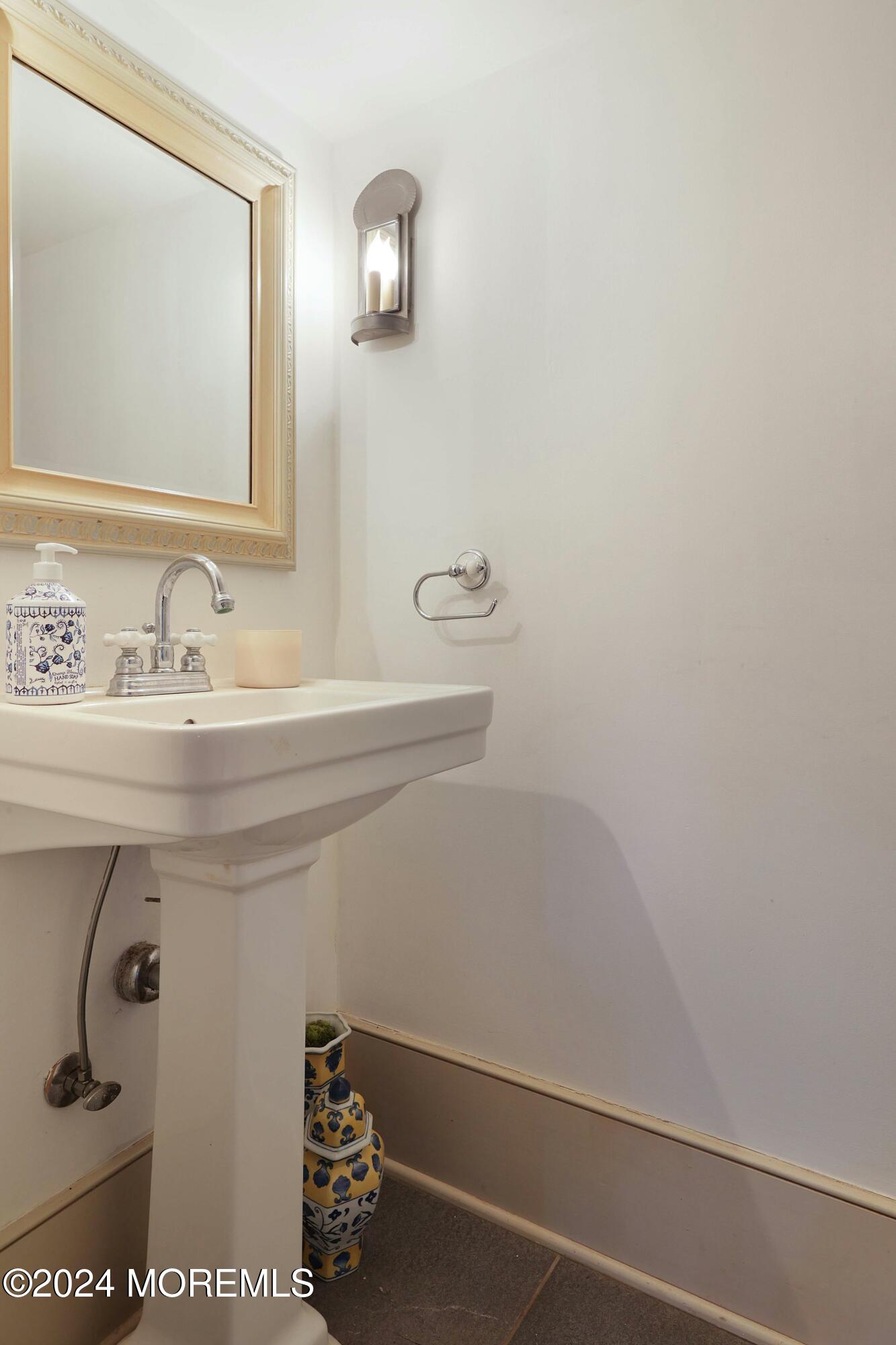 125 Sandy Ridge Road Stockton, NJ 08559 - Photo 18 of 46 a bathroom with a sink and a mirror