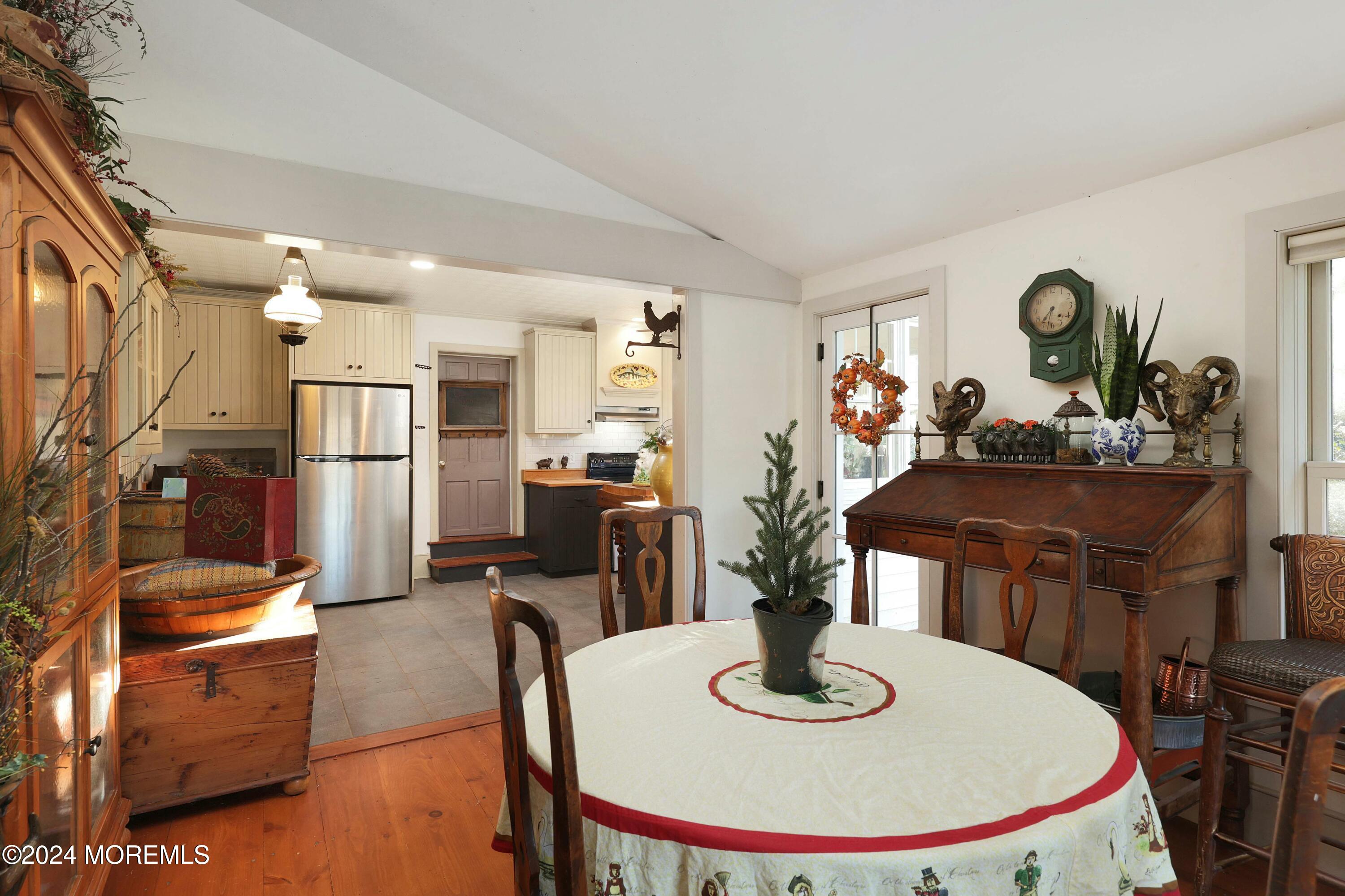 125 Sandy Ridge Road Stockton, NJ 08559 - Photo 24 of 46 a kitchen with stainless steel appliances granite countertop a dining table and chairs