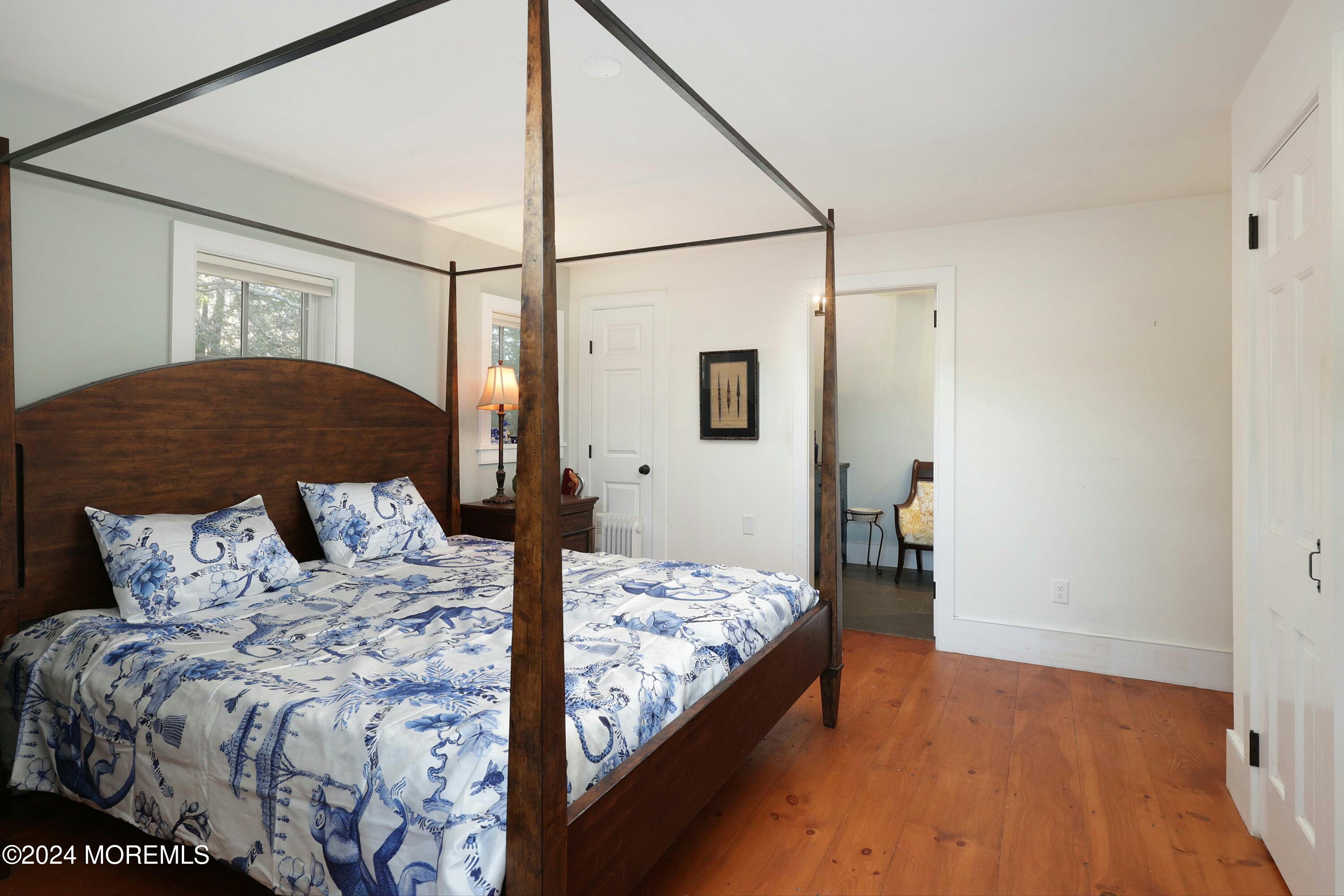 125 Sandy Ridge Road Stockton, NJ 08559 - Photo 28 of 46 a bedroom with a bed and a dresser