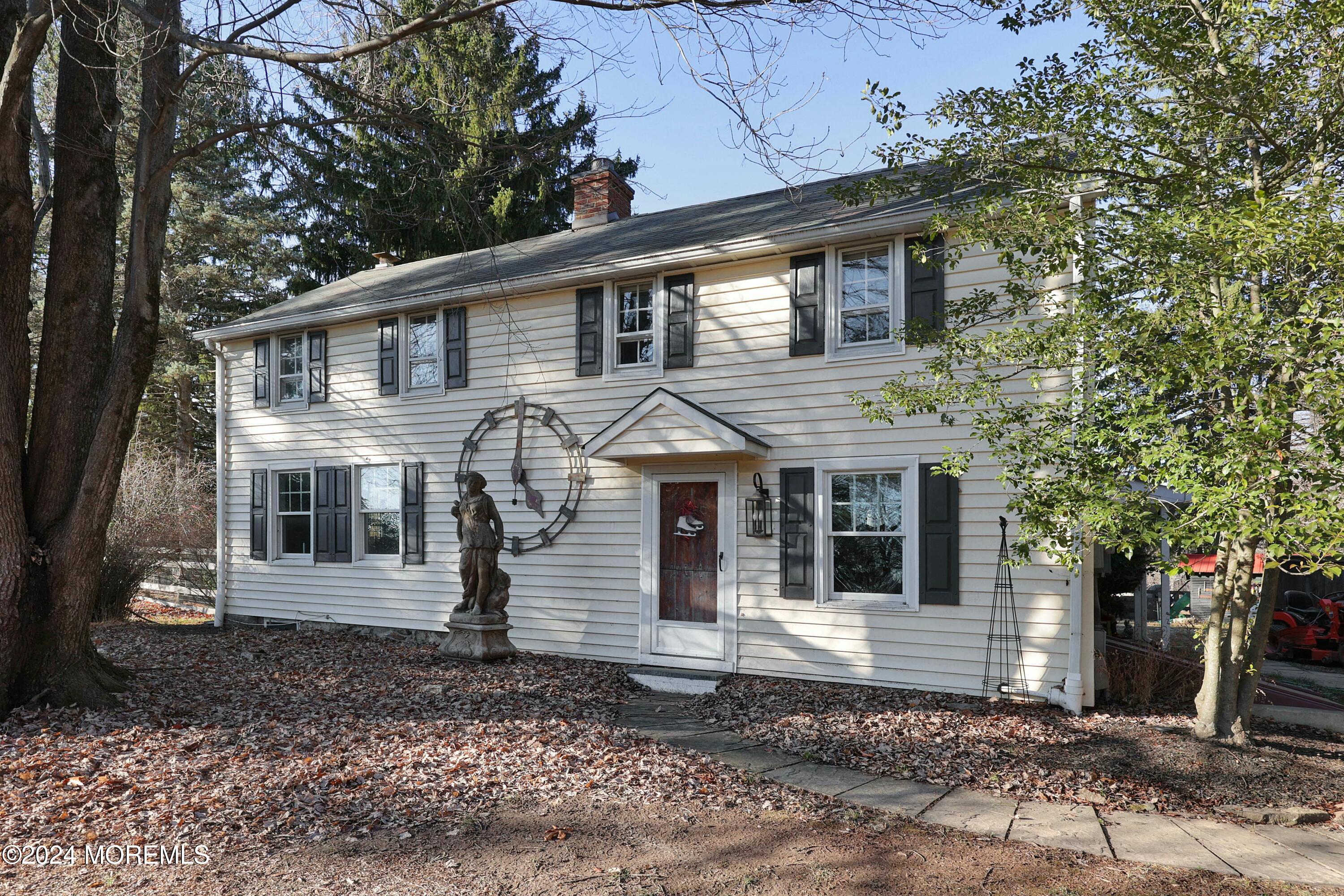 125 Sandy Ridge Road Stockton, NJ 08559 - Photo 3 of 46 a front view of a house with a garden