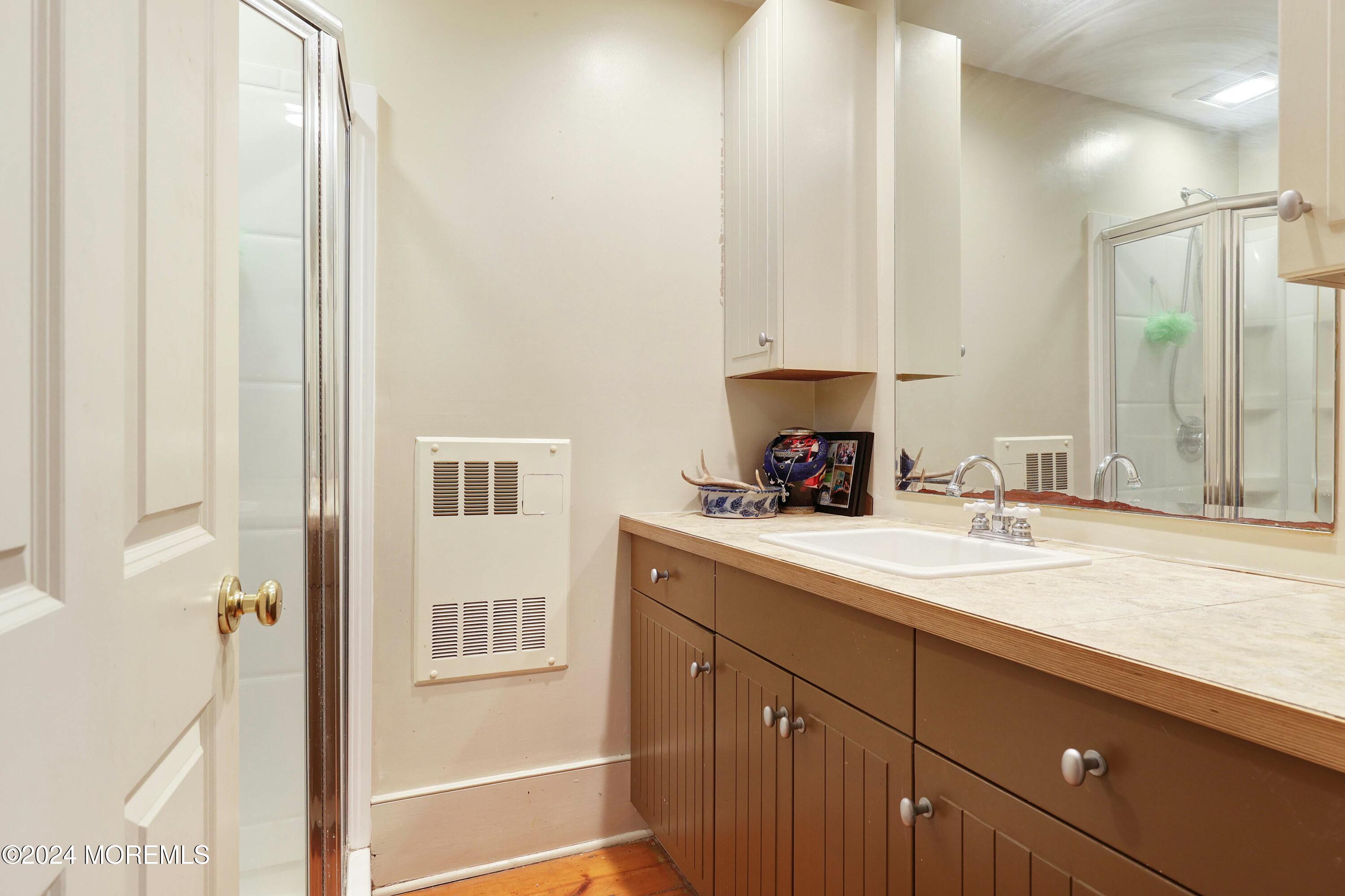 125 Sandy Ridge Road Stockton, NJ 08559 - Photo 35 of 46 a kitchen with a sink and cabinets