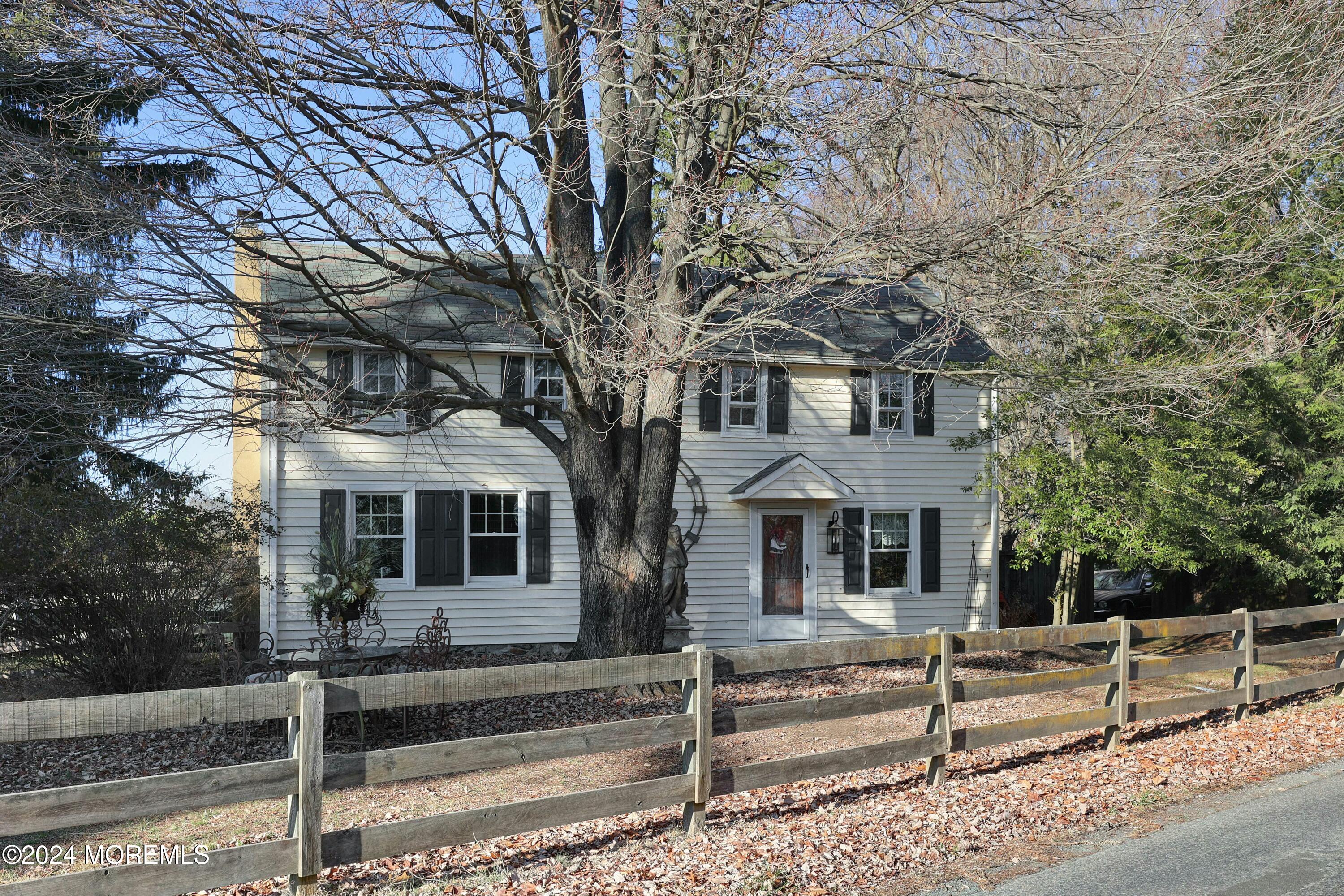 125 Sandy Ridge Road Stockton, NJ 08559 - Photo 4 of 46 a front view of a house with a tree