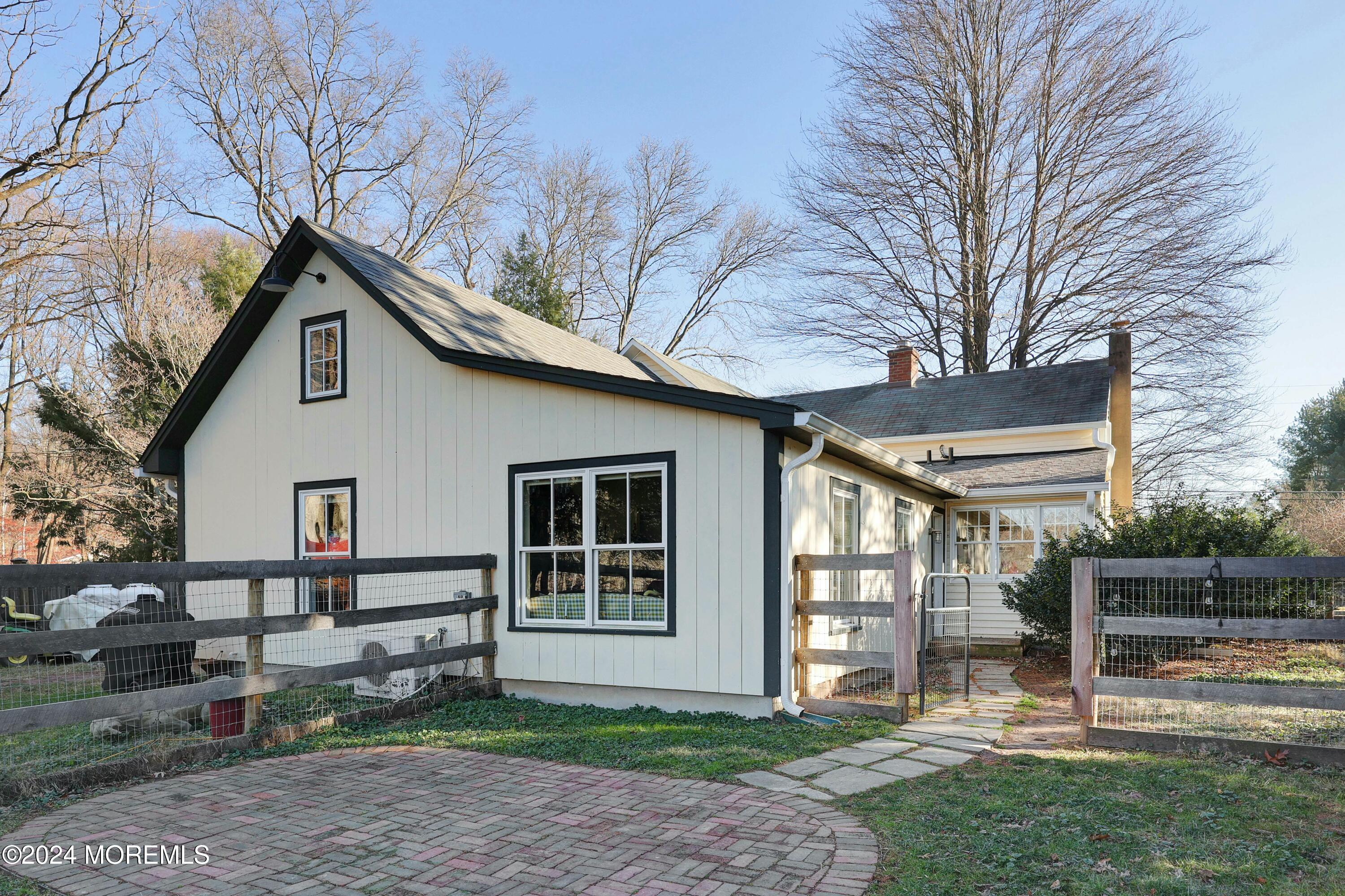 125 Sandy Ridge Road Stockton, NJ 08559 - Photo 8 of 46 a front view of a house with a yard