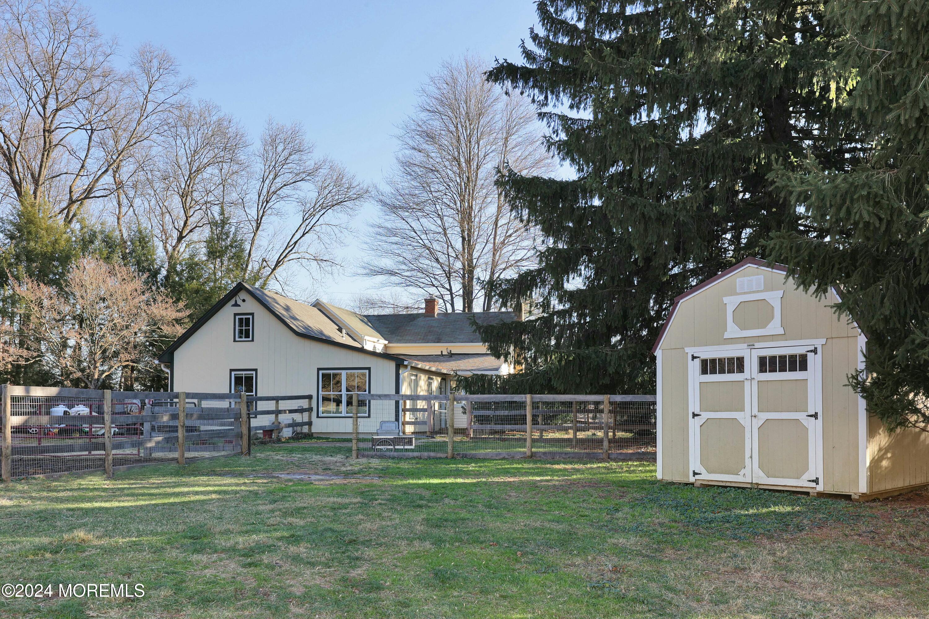 125 Sandy Ridge Road Stockton, NJ 08559 - Photo 9 of 46 a front view of a house with a yard