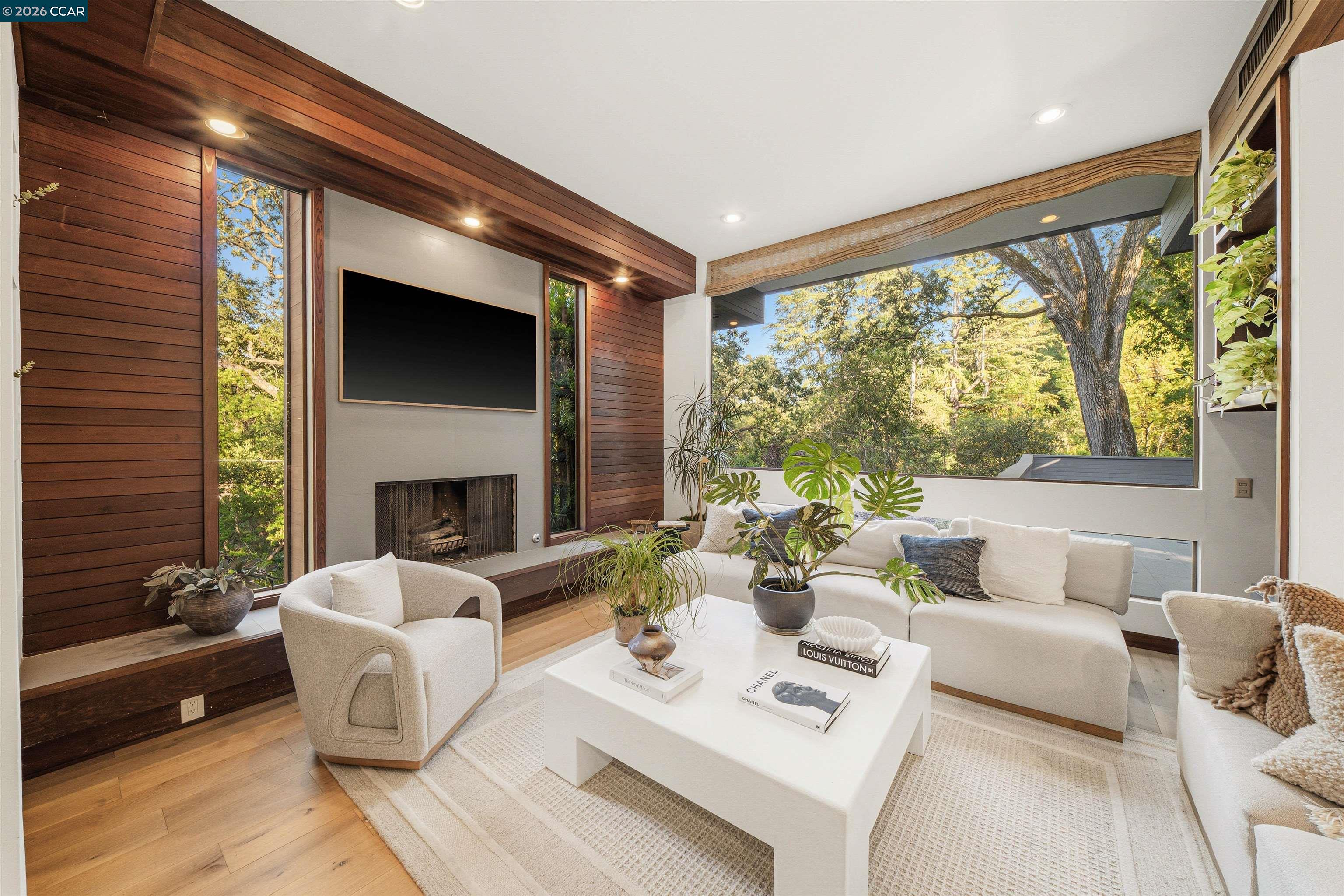 841 Kirkcrest Road Alamo, CA 94507 - Photo 24 of 62 a living room with furniture fireplace and a large window