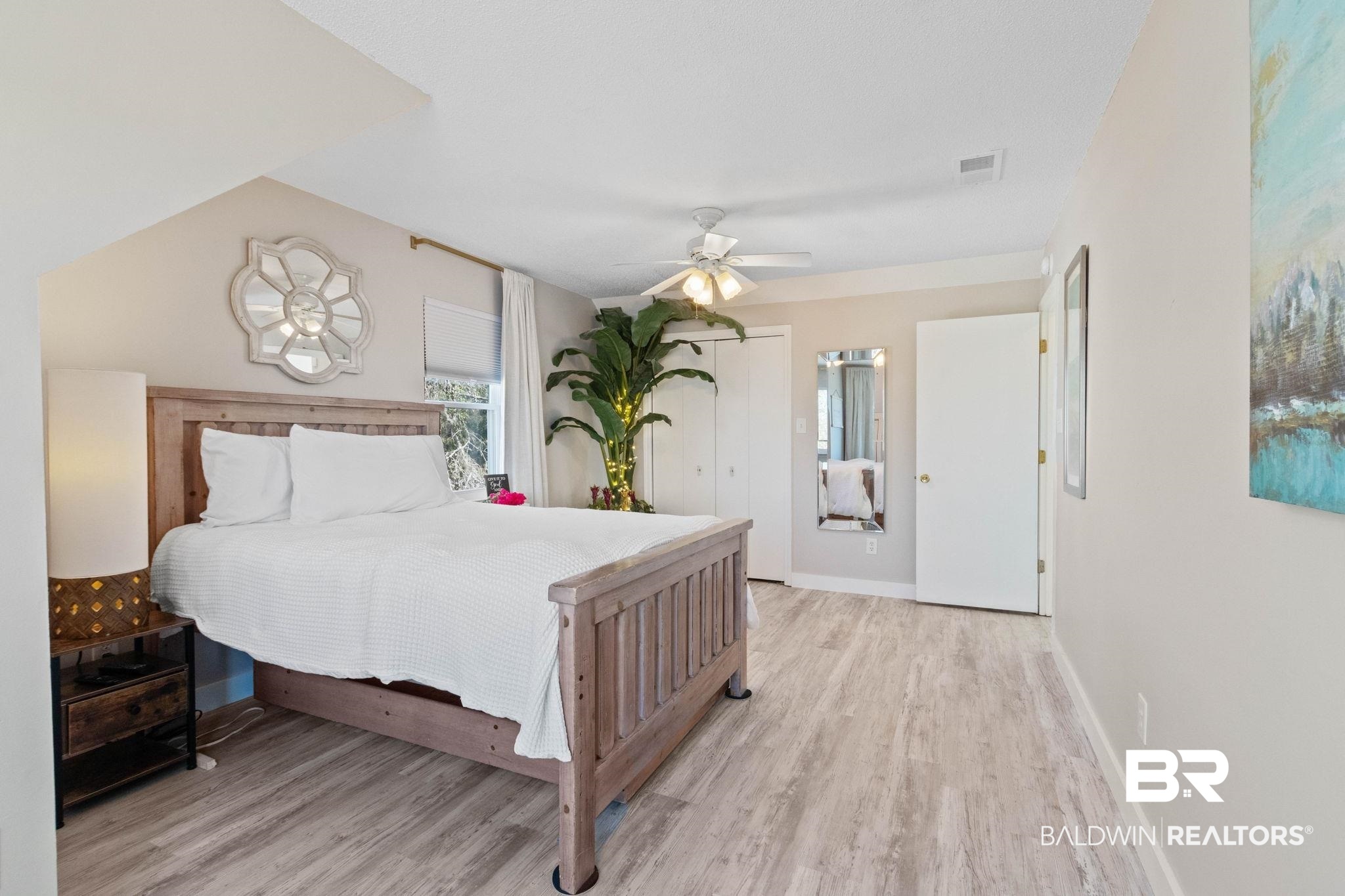 41997 Bayou Road Bay Minette, AL 36507 - Photo 43 of 68 Bedroom featuring wood finished floors, vaulted ceiling, and an abundance of light