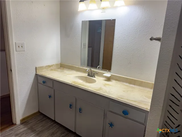 a bathroom with a shower and a bath tub