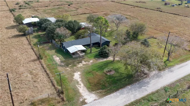 an aerial view of residential house with outdoor space