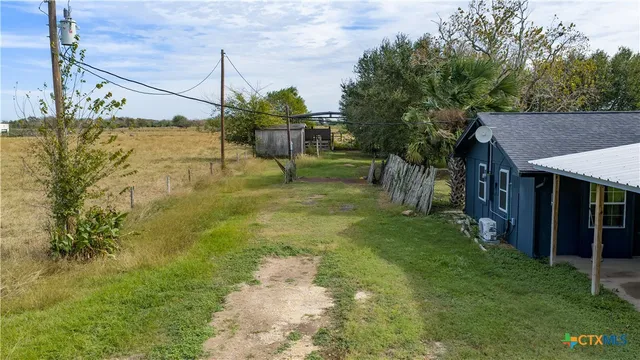 a view of a yard with a house