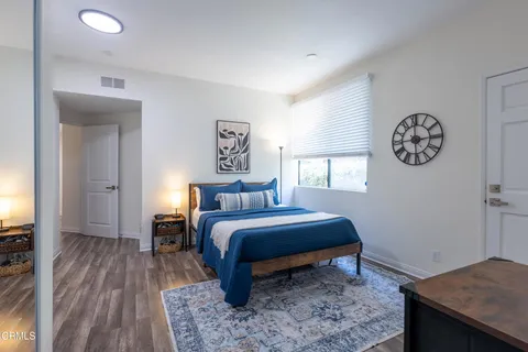 a bedroom with a bed and a table
