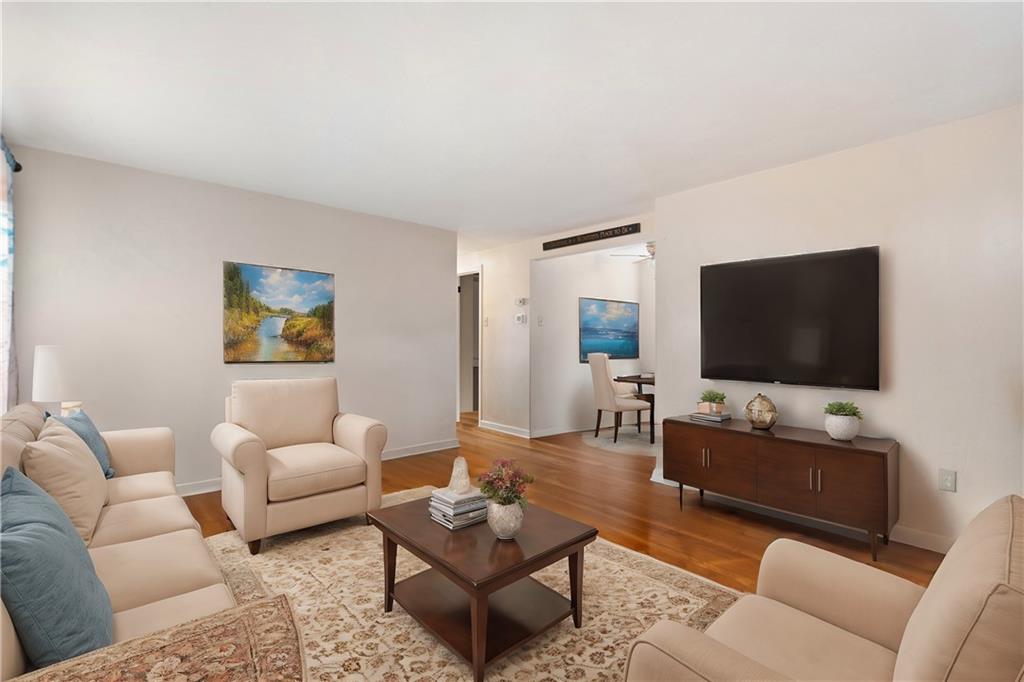 227 Duncan Station Road McKeesport, PA 15135 - Photo 2 of 10 a living room with furniture and a flat screen tv