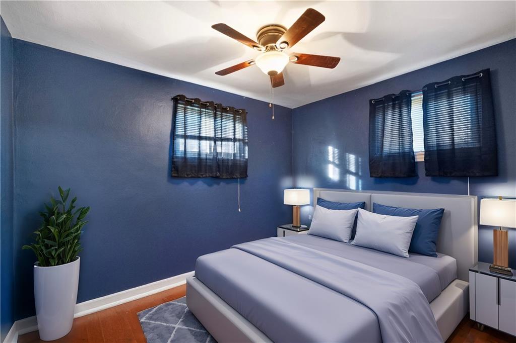 227 Duncan Station Road McKeesport, PA 15135 - Photo 6 of 10 a bedroom with a bed and a potted plant