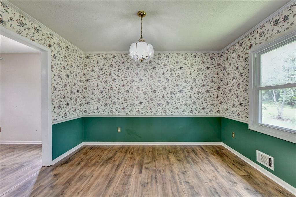 1577 Harbour Oaks Road Tucker, GA 30084 - Photo 12 of 58 a view of a room with wooden floor and fan