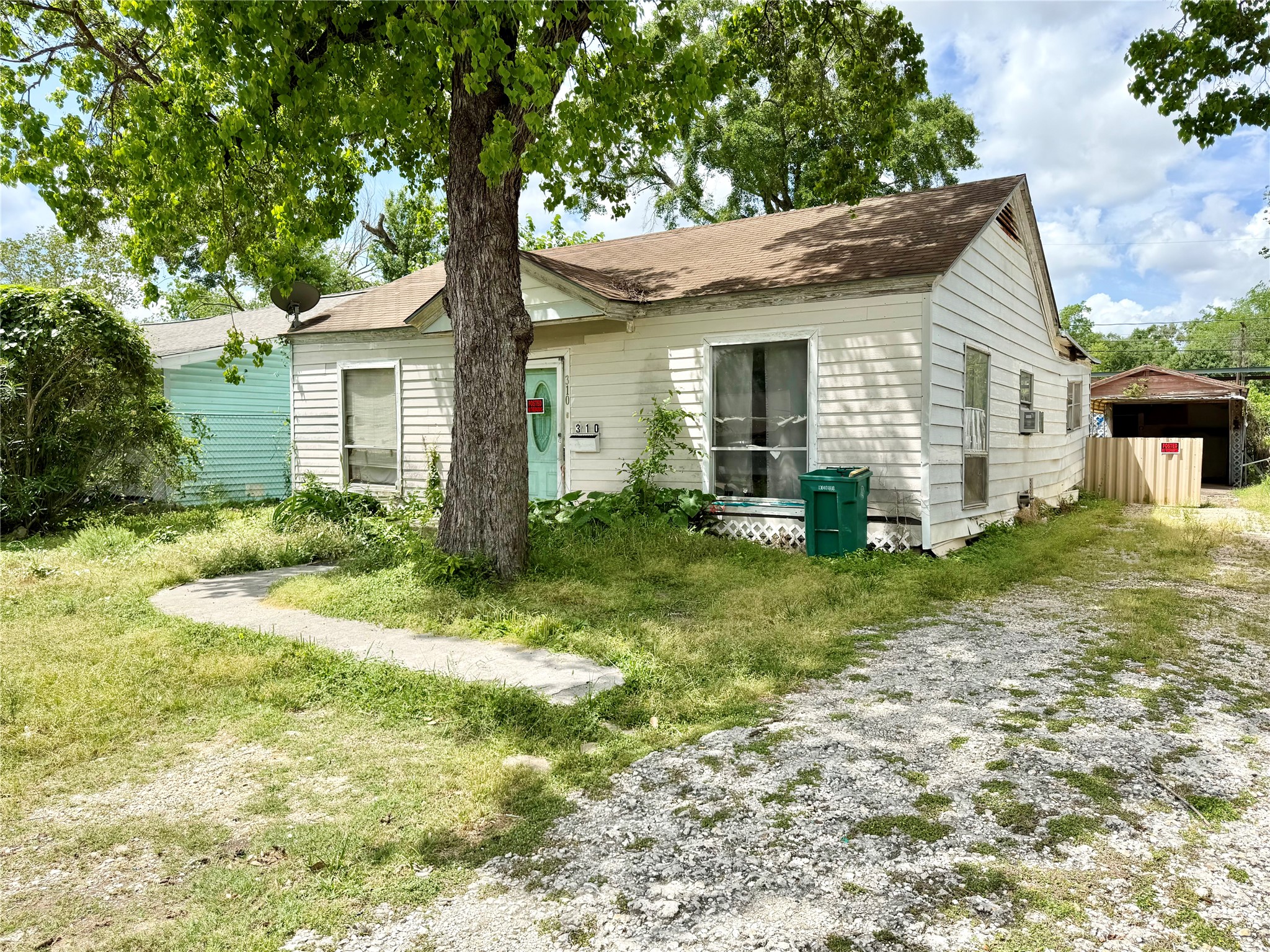 310 Center Street Pasadena, TX 77506 - Photo 2 of 10 a front view of house with yard and trees