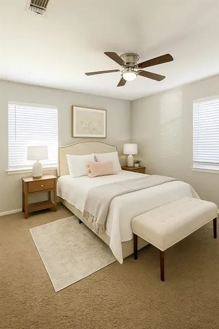 a bedroom with a bed and a window