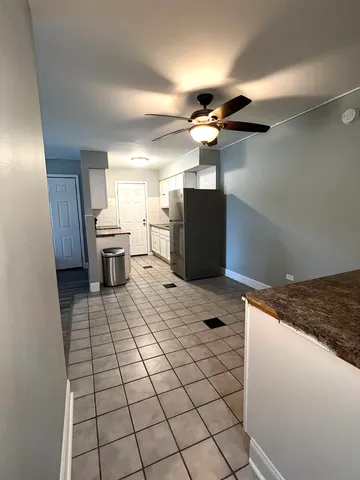 a view of a refrigerator and window