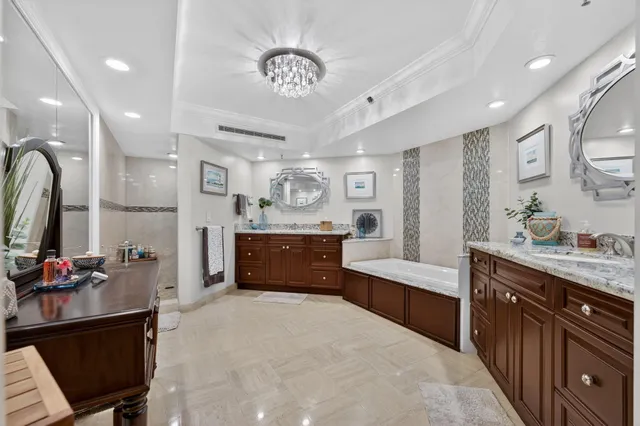 a bedroom with a bed a couch and dresser