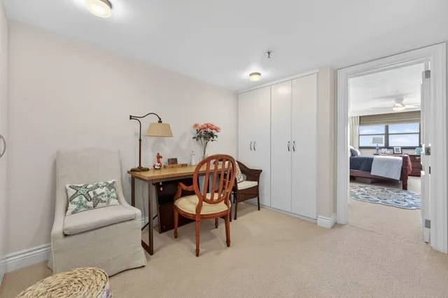 a spacious bathroom with a tub double sink and mirror